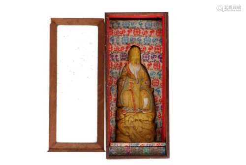 A polychrome ink sculpture of the god of longevity, in wooden box with glass. China, 20th century.