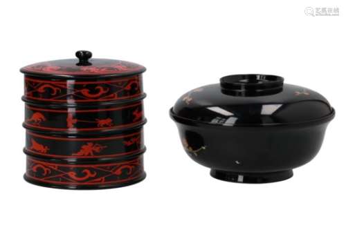 A black and red lacquer 4-layer lidded box, decorated with animals. Unmarked. Added a black