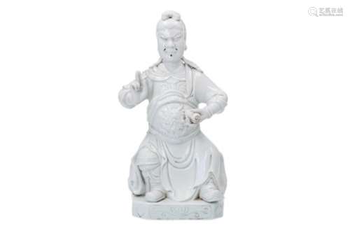 A blanc de Chine porcelain sculpture of Guan Gong with scroll. Marked with seal mark He Chao Zong.