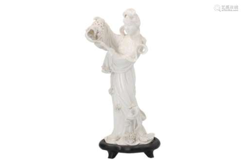 A blanc de Chine sculpture depicting a standing lady on wooden base. Unmarked. China, 20th