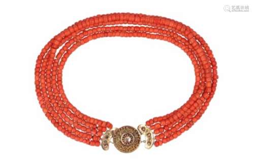 A 5-strand red coral necklace with 14-kt golden clasp. diam. approx. 5,6 - 6,2 mm. Tot. weight