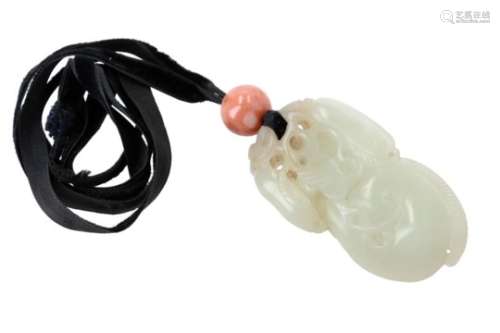 A carved jade pendant (tossel). China, 19th century. H. approx. 6 cm.