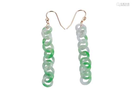 A pair of white and green jade earrings.