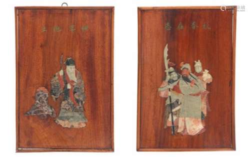 A pair of wooden panels with i.a. jade and soapstone inlay of figures and a Chinese saying. China,