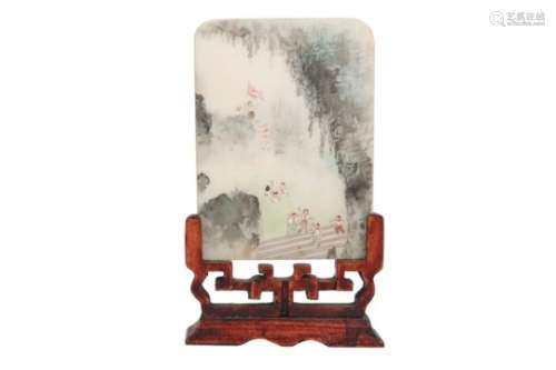A polychrome stone miniature table screen in a wooden stand, decorated with young gardists. China,