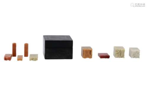 A square seal box with nine blank soapstone seals in various colors. China, late Qing/Republic. Dim.