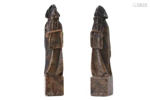 A pair of soapstone sculptures of standing figures. China, 19th century. H. 8,5 cm.