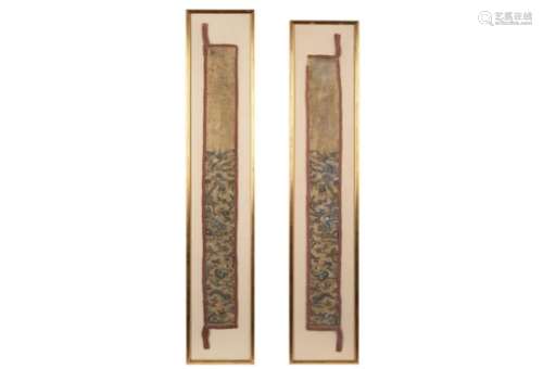 A pair of embroided silk textiles in frame, decorated with figures, trees and a building. China,