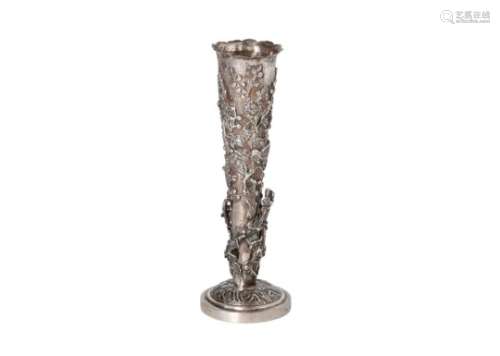 A silver vase with floral design and birds in high relief decoration. China, approx. 1900. H. 18