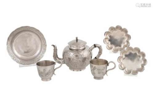 A pair of silver cups with saucers, China approx. 1900. Added a silver plated teapot and saucer.