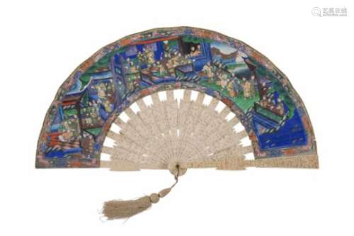 A carved ivory fan, with watercolor decor of figures in garden and interior. The faces of the