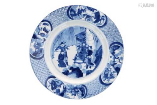 A blue and white porcelain dish, decorated with a beheading scene. The rim with antiquities and
