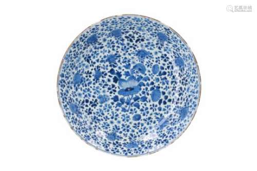 A blue and white porcelain deep charger, decorated with flowers. Marked with artemisia leaf.