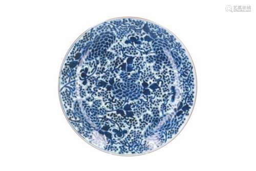 A blue and white porcelain charger, decorated with flowers. Marked with symbol. China, Kangxi. Diam.