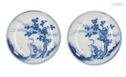 A pair of blue and white porcelain dishes, decorated with a crane, tree and bamboo. Marked with 6-