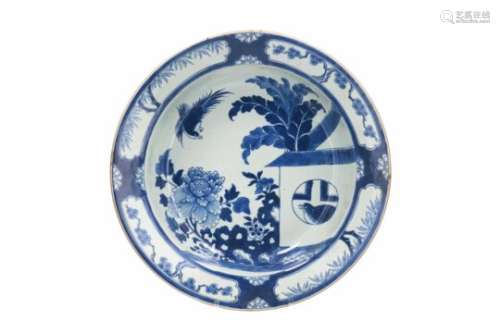 A large blue and white porcelain deep charger, decorated with 'Koekoek in het huisje'. Unmarked.