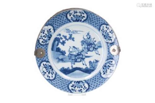 A blue and white porcelain charger with Dutch silver handle, decorated with 'Joosje te paard' and
