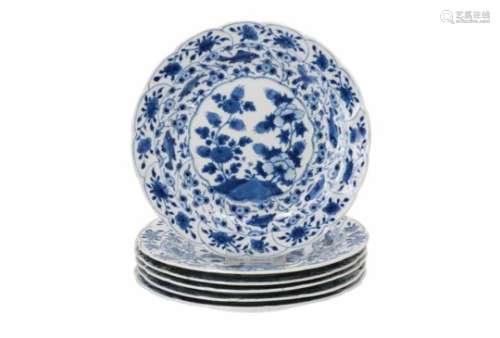 A set of six blue and white porcelain dishes, decorated with fruits. The rim with fish, shrimps