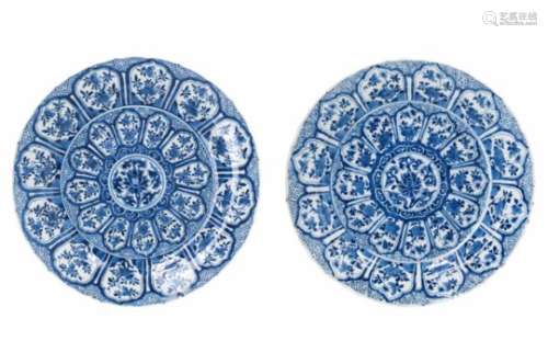 A pair of blue and white porcelain chargers, decorated with flowers. Marked with symbol. China,