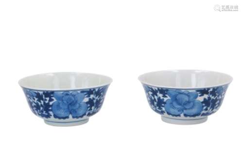 A pair of blue and white porcelain bowls, decorated with flowers. Marked with 4-character mark Ruo