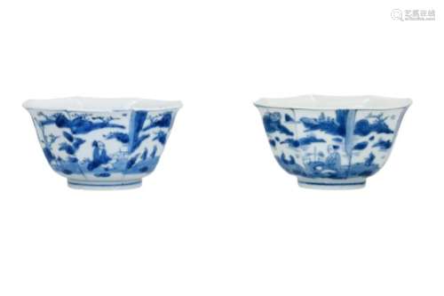 A pair of octagonal blue and white porcelain bowls, decorated with figures in a landscape. Unmarked.