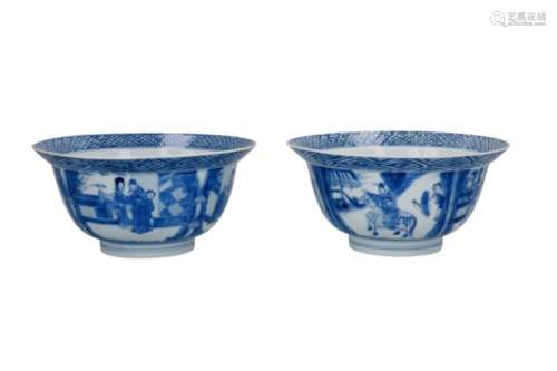 A pair of blue and white porcelain 'klapmuts' bowls, decorated with figures and playing little boys.