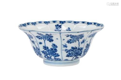A blue and white porcelain lobed bowl, decorated with flowers, birds and insects. Marked with seal