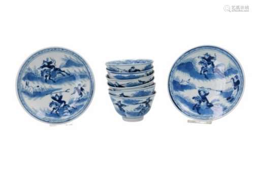 A set of six blue and white porcelain cups with two saucers, decorated with flowers and 'Joosje te