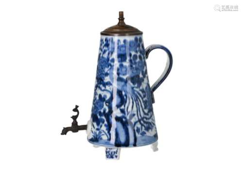 A blue and white porcelain jug with bronze tap, decorated with phoenixes and flowers. Converted into