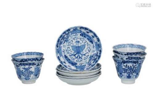 A set of five blue and white porcelain cups with saucers, decorated with a phoenix, flowers and