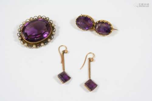 AN AMETHYST, PEARL AND GOLD BROOCH the oval-shaped amethyst is set within a gold border mounted with