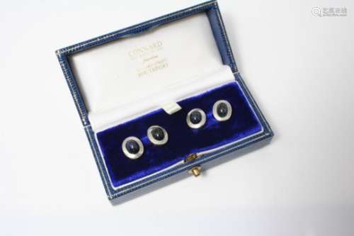A PAIR OF SAPPHIRE CUFFLINKS each link with an oval cabochon sapphire set in a platinum and yellow