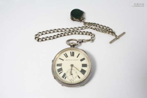 A LARGE SILVER OPEN FACED POCKET WATCH the white enamel dial with Roman numerals and subsidiary