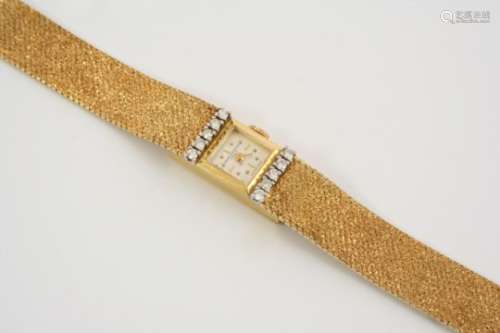 A LADY'S 18CT. GOLD AND DIAMOND WRISTWATCH BY BAUME & MERCIER the signed square-shaped dial with dot
