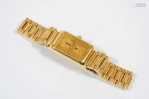 A LADY'S GOLD INGOT WATCH BY CORUM mounted in an 18ct. gold case, quartz movement, numbered to the