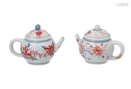 A pair of Imari porcelain miniature teapots, decorated with flowers. Unmarked. China, 18th