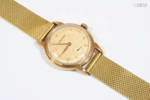A GENTLEMAN'S GOLD WRISTWATCH BY GARRARD the signed circular dial with Arabic numerals and