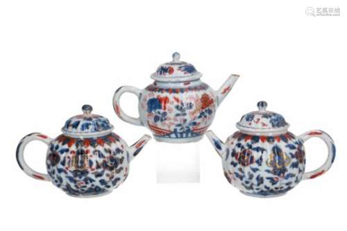 A pair of Imari porcelain teapots with floral decor. Unmarked. Added an Imari porcelain teapot