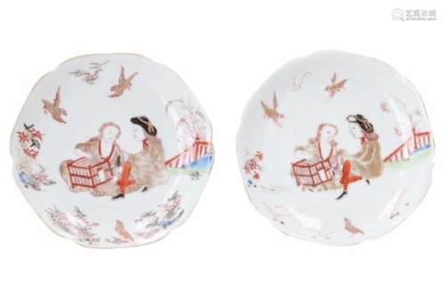 A pair of Chine de commande polychrome porcelain saucers, decorated with an erotic scene.