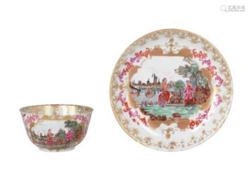 A Chine de commande polychrome porcelain cup and saucer, decorated with figures in a harbor scene.