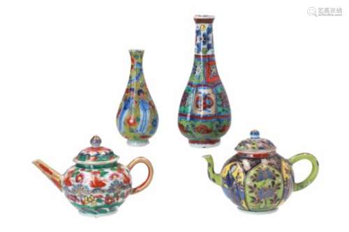 Two polychrome clobber ware porcelain miniature teapots, decorated with flowers and figures. One
