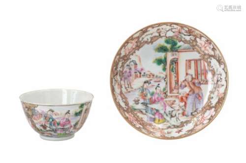 A polychrome porcelain cup with saucer, decorated with Mandarins, dogs and birds. Unmarked. China,