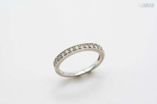 A DIAMOND HALF HOOP RING mounted with fourteen circular-cut diamonds, in 18ct. gold. Size O.