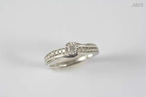 A DIAMOND SOLITAIRE RING the circular-cut diamond weighs 0.33 carats and is set with nine