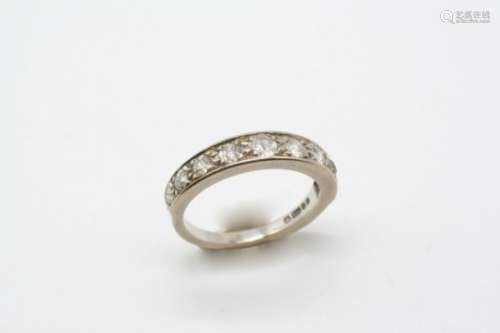 A DIAMOND HALF CIRCLE ETERNITY RING millegrain set with nine old brilliant-cut diamonds, in 18ct.