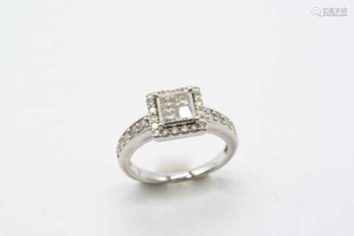 A DIAMOND CLUSTER RING centred with four princess-cut diamonds within a surround of circular-cut