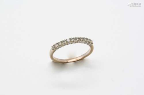 A DIAMOND HALF HOOP RING set with circular-cut diamonds, in white gold. Size N.