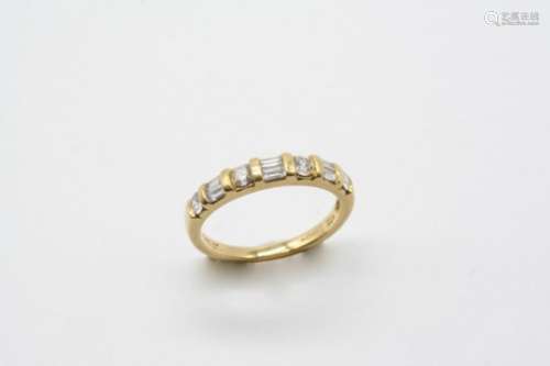 A DIAMOND HALF HOOP RING mounted alternately with a circular-cut diamond and pairs of baguette-cut