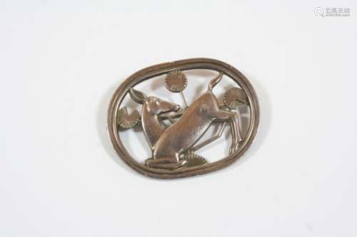 A SILVER BROOCH BY GEORG JENSEN depicting a deer amongst foliate, design no. 256, signed to the