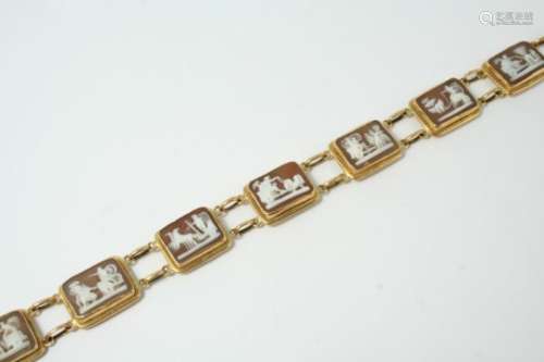 A CARVED SHELL CAMEO BRACELET formed with seven rectangular shell cameo plaques depiciting classical